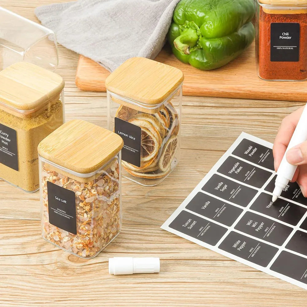 Set of glass spice jars with bamboo lids, offering a stylish and eco-friendly storage solution. Perfect for organizing and preserving spices, herbs, or other kitchen essentials.