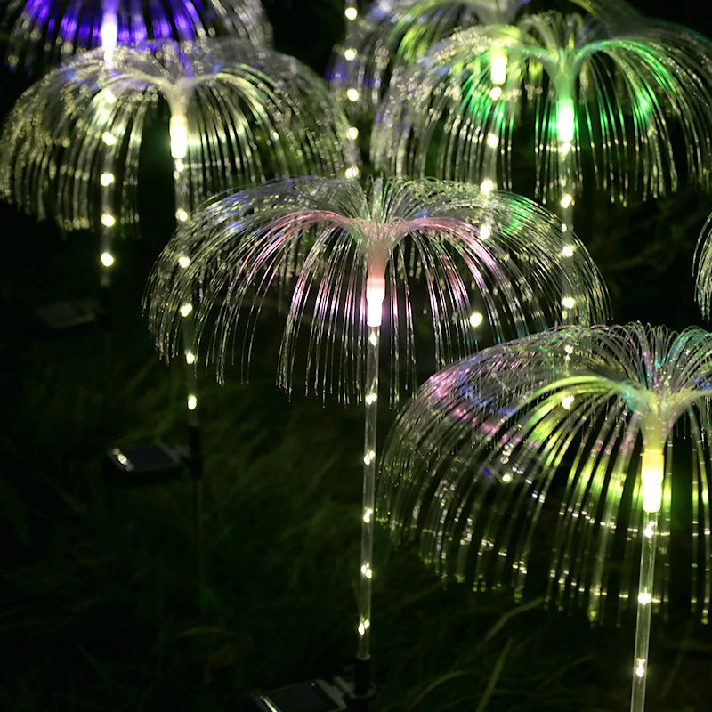 A solar-powered fiber optic lamp featuring multi-color illumination. The lamp harnesses sunlight during the day to power vibrant, color-changing fiber optic strands at night, creating a mesmerizing display suitable for gardens, patios, or outdoor pathways.