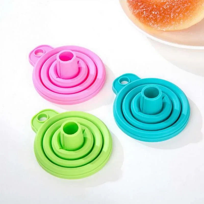 A foldable funnel, also known as a collapsible funnel, is a kitchen tool designed to assist in transferring liquids or powders into containers with small openings. Made from flexible materials like silicone, these funnels can be expanded for use and collapsed for convenient storage, making them space-efficient and practical for various kitchen tasks