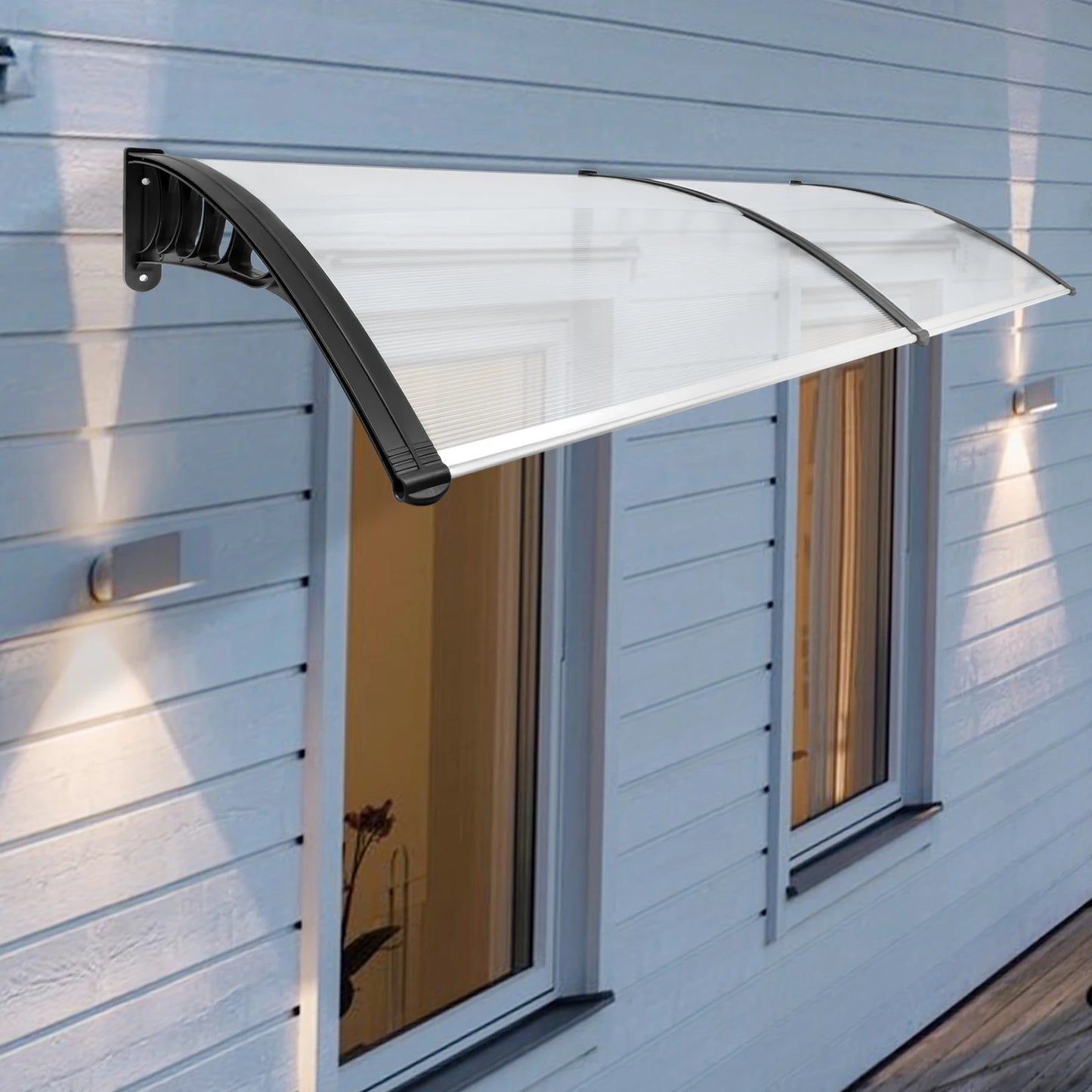 A front door canopy, also known as a door awning, is a protective structure attached above a doorway. It shields the entrance from weather elements such as rain, snow, and sun, enhancing both the functionality and aesthetic appeal of the home's exterior