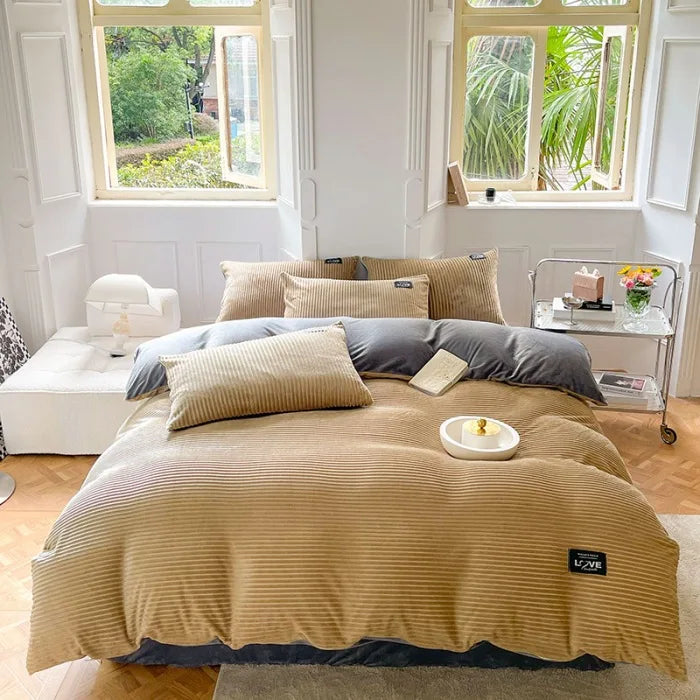 A 3-piece bedding set comprising a comforter and two pillowcases, designed to enhance your bedroom's aesthetic. Available in various patterns and materials, these sets cater to diverse preferences and are available in multiple sizes to fit different bed dimensions