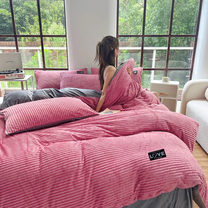 A 3-piece bedding set comprising a comforter and two pillowcases, designed to enhance your bedroom's aesthetic. Available in various patterns and materials, these sets cater to diverse preferences and are available in multiple sizes to fit different bed dimensions