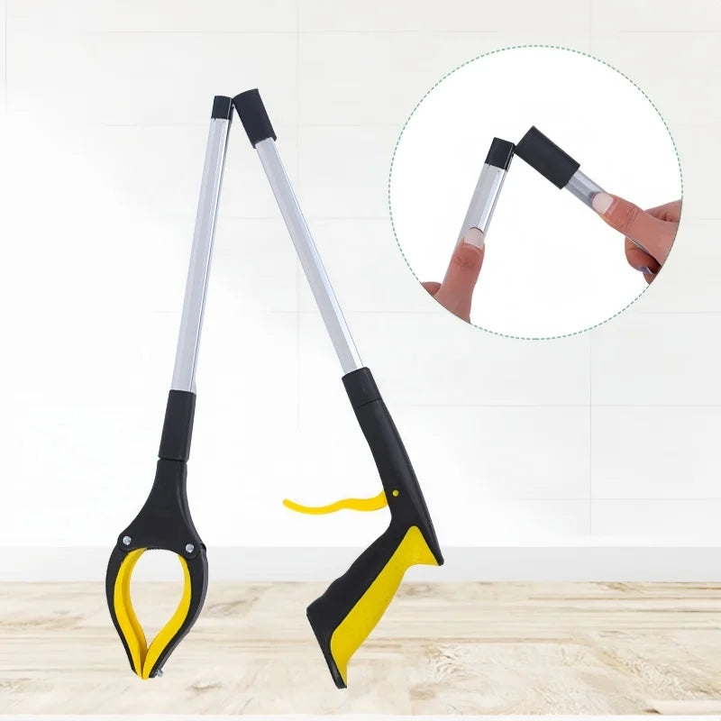 "A foldable reach extender, commonly known as a grabber or helping hand, designed to assist users in picking up objects without bending or stretching. The tool features a lightweight, collapsible aluminum shaft approximately 32 inches long, with an ergonomic handle and a trigger mechanism that controls the rubberized gripping jaws at the opposite end. Ideal for individuals with limited mobility, it aids in retrieving items from high shelves or the ground