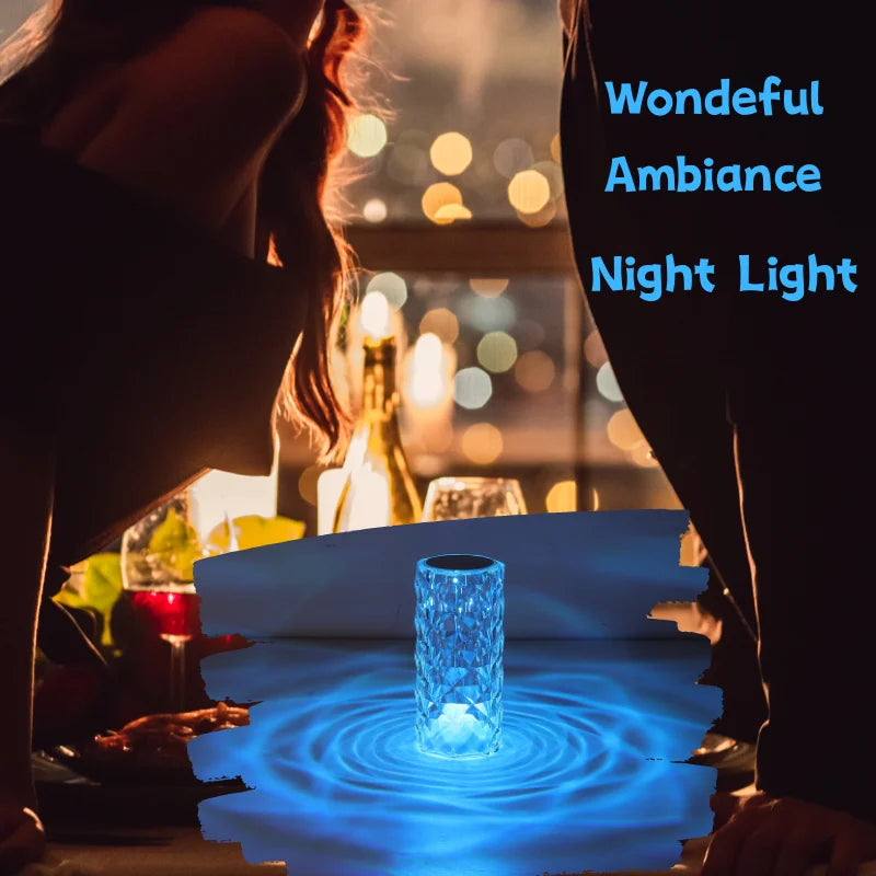 A crystal table lamp featuring a gleaming crystal base with intricate facets that refract light, complemented by an elegant lampshade. This decorative lighting piece adds a touch of sophistication and glamour to any room, creating a warm and inviting ambiance