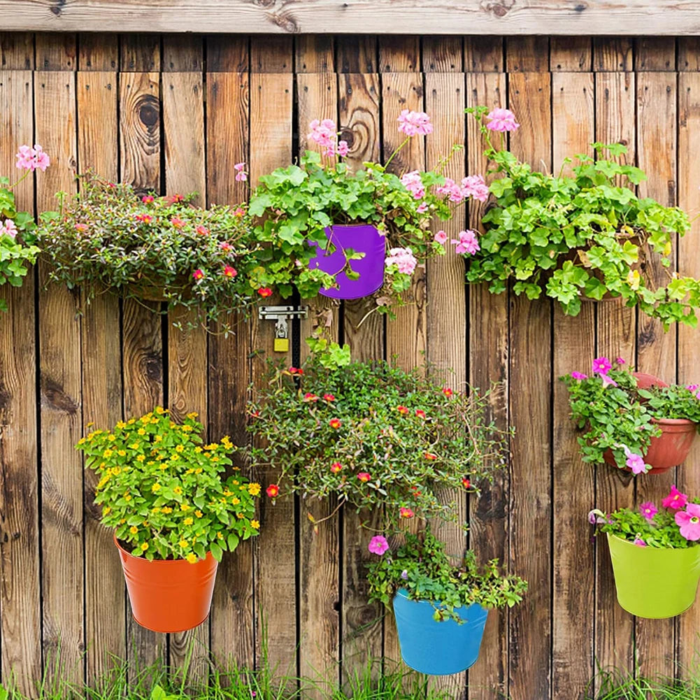 A set of colorful metal iron hanging flower pots with detachable hooks, designed to hang on balconies, fences, or garden railings; ideal for displaying vibrant flowers or plants, adding charm and greenery to outdoor spaces