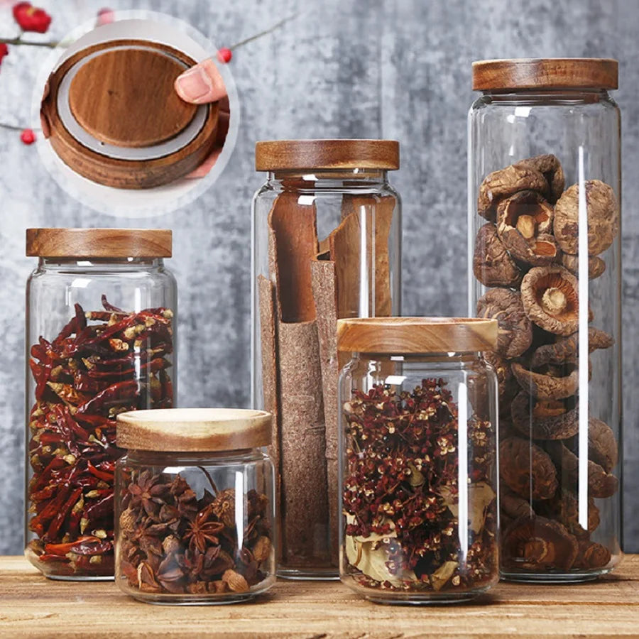 A collection of clear glass storage jars with airtight lids, ideal for organizing and preserving various kitchen staples such as pasta, grains, spices, and snacks. Their transparent design allows for easy identification of contents, while the airtight seals maintain freshness and prevent moisture intrusion. These jars not only provide practical storage solutions but also add a touch of elegance to kitchen countertops or pantry shelves