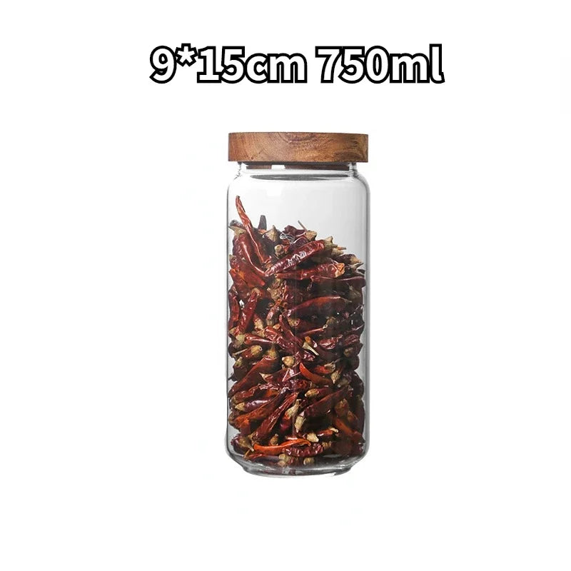 A collection of clear glass storage jars with airtight lids, ideal for organizing and preserving various kitchen staples such as pasta, grains, spices, and snacks. Their transparent design allows for easy identification of contents, while the airtight seals maintain freshness and prevent moisture intrusion. These jars not only provide practical storage solutions but also add a touch of elegance to kitchen countertops or pantry shelves