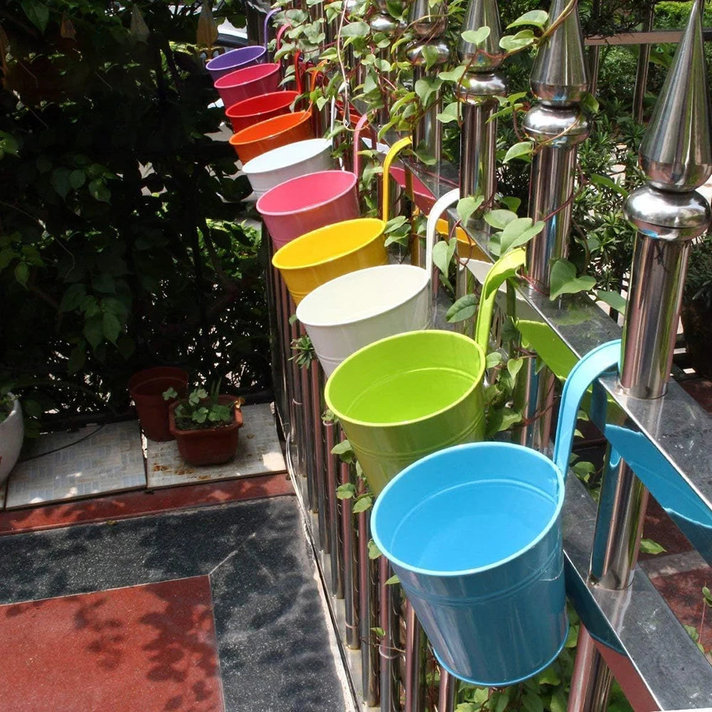 A set of colorful metal iron hanging flower pots with detachable hooks, designed to hang on balconies, fences, or garden railings; ideal for displaying vibrant flowers or plants, adding charm and greenery to outdoor spaces