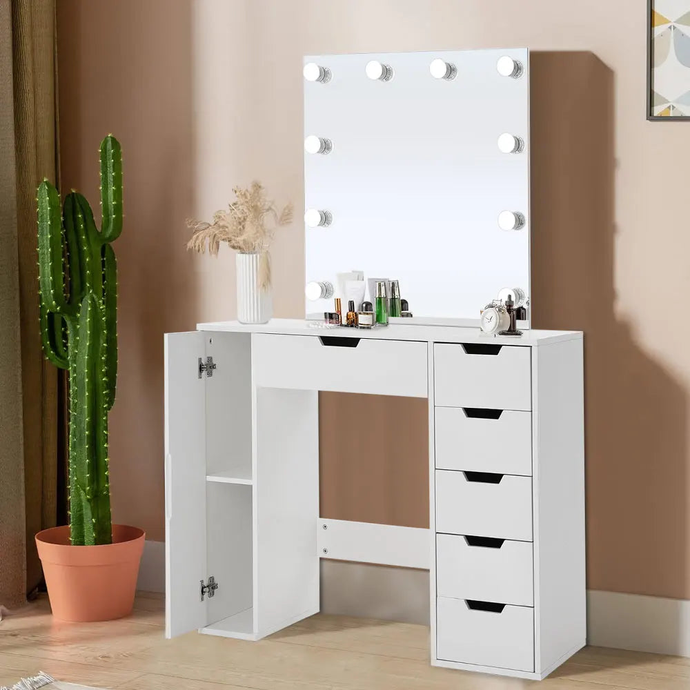 A stylish Hollywood makeup dressing table with bright LED lights around the mirror, offering a well-lit space for makeup application. The table features a sleek design with ample storage space for cosmetics and beauty tools.