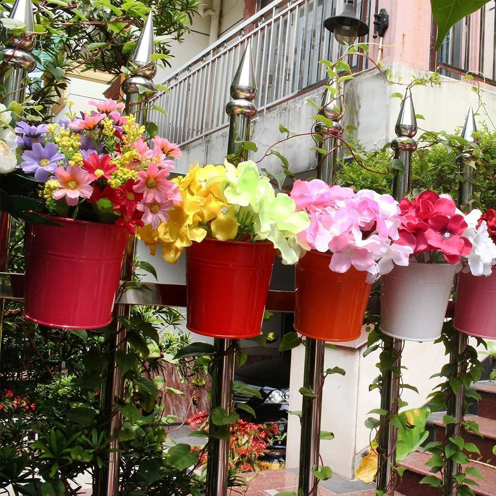 A set of colorful metal iron hanging flower pots with detachable hooks, designed to hang on balconies, fences, or garden railings; ideal for displaying vibrant flowers or plants, adding charm and greenery to outdoor spaces