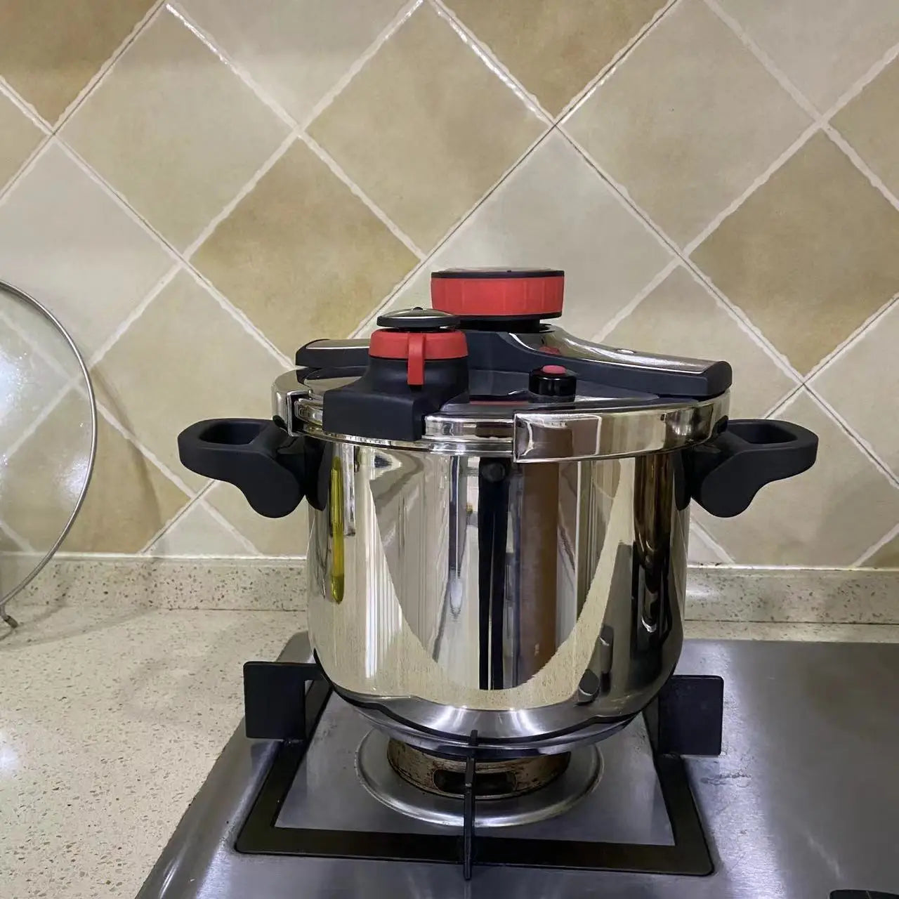 A pressure cooker is a kitchen appliance that uses steam and high pressure to cook food quickly, preserving nutrients and flavors. Modern pressure cookers come in various sizes and styles, including stovetop and electric models.