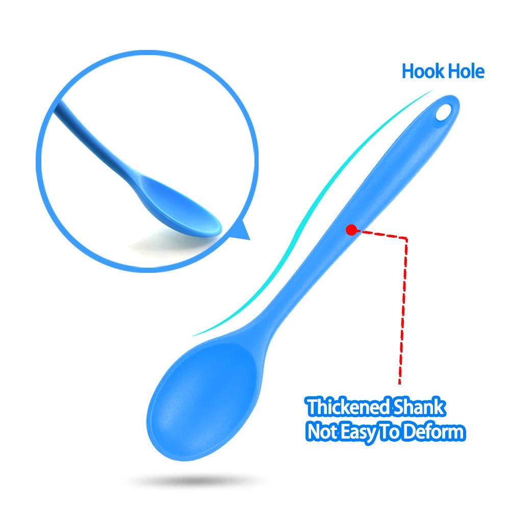 A soft silicone spoon designed for stirring, featuring a flexible, heat-resistant head that protects non-stick cookware. The ergonomic handle ensures a comfortable grip, making it ideal for mixing, scooping, and serving a variety of dishes