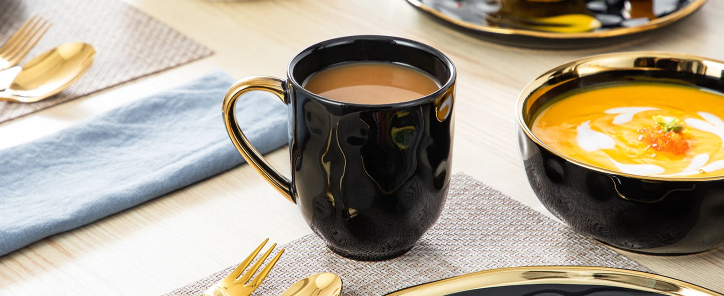 A sophisticated black porcelain dinnerware set featuring elegant gold trim accents. This set typically includes dinner plates, salad plates, bowls, and mugs, all crafted from high-quality porcelain. The combination of deep black hues with refined gold detailing adds a touch of luxury to both everyday dining and special occasions