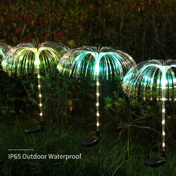 A solar-powered fiber optic lamp featuring multi-color illumination. The lamp harnesses sunlight during the day to power vibrant, color-changing fiber optic strands at night, creating a mesmerizing display suitable for gardens, patios, or outdoor pathways.