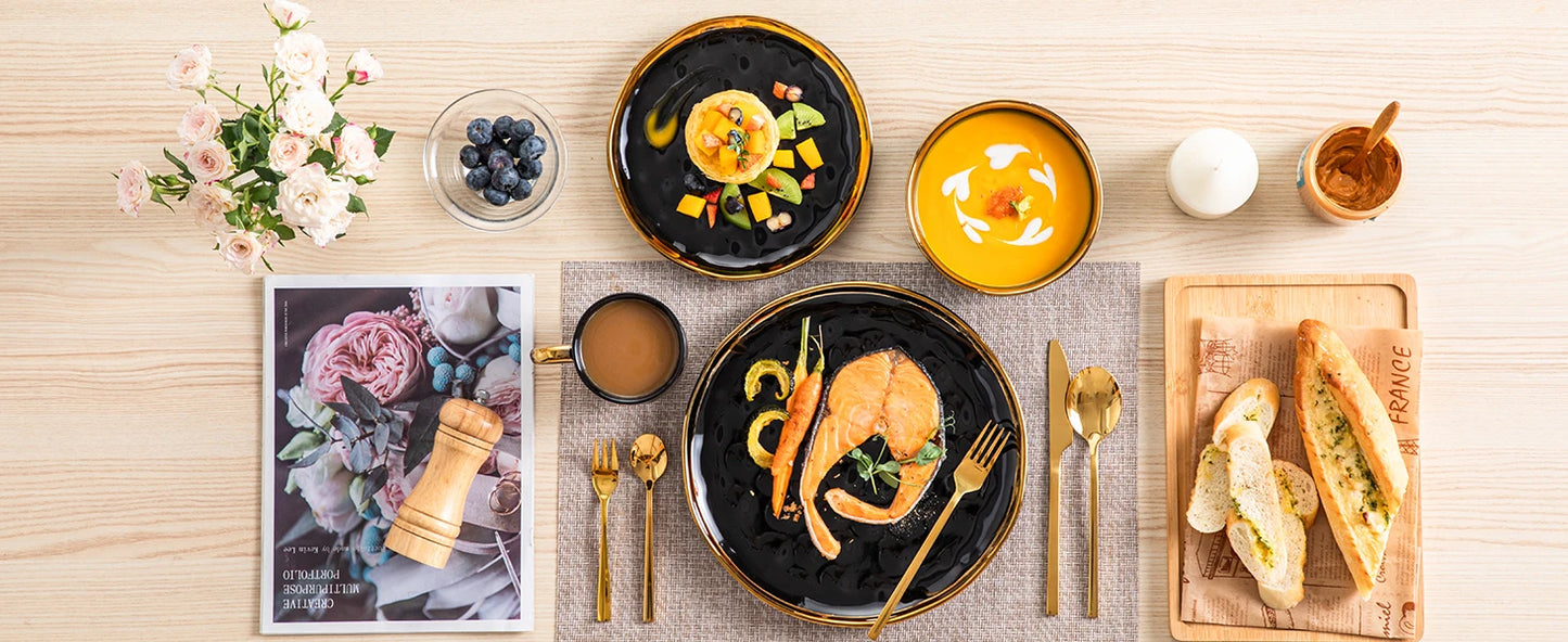 A sophisticated black porcelain dinnerware set featuring elegant gold trim accents. This set typically includes dinner plates, salad plates, bowls, and mugs, all crafted from high-quality porcelain. The combination of deep black hues with refined gold detailing adds a touch of luxury to both everyday dining and special occasions