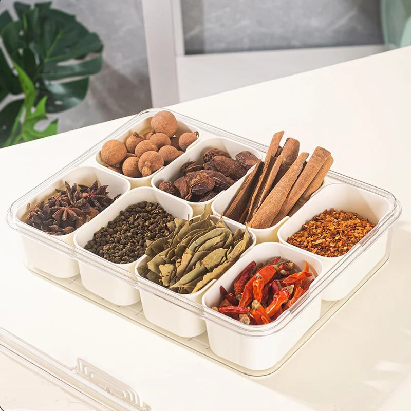 A divided serving tray storage box featuring multiple compartments, a secure lid, and a handle for easy portability; ideal for organizing and transporting snacks, fruits, nuts, or appetizers during events, picnics, or daily use