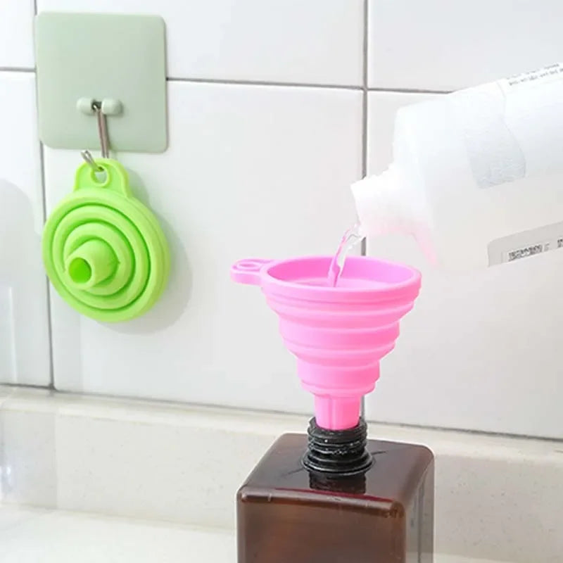 A foldable funnel, also known as a collapsible funnel, is a kitchen tool designed to assist in transferring liquids or powders into containers with small openings. Made from flexible materials like silicone, these funnels can be expanded for use and collapsed for convenient storage, making them space-efficient and practical for various kitchen tasks