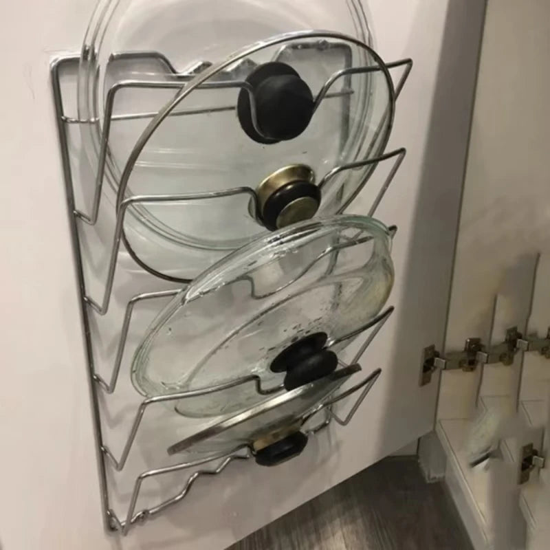 A hanging pot lid holder, designed to store pot lids efficiently by hanging them on a wall or inside a cabinet door, featuring adjustable dividers to accommodate various lid sizes, made from durable materials like metal or bamboo, and designed to save kitchen space while keeping lids organized
