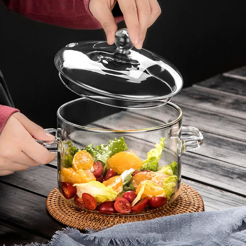 A durable heat-resistant glass saucepan, perfect for cooking at high temperatures, with a sturdy handle and transparent design for easy monitoring of food.