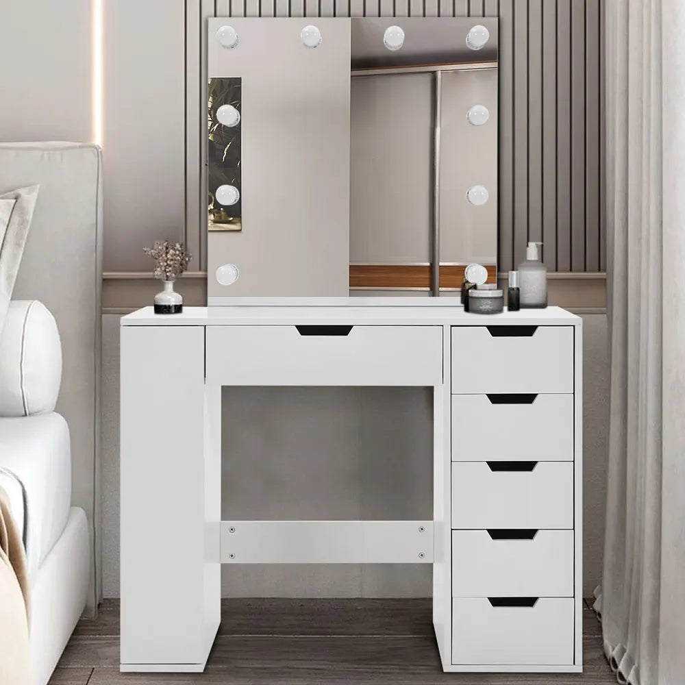 A stylish Hollywood makeup dressing table with bright LED lights around the mirror, offering a well-lit space for makeup application. The table features a sleek design with ample storage space for cosmetics and beauty tools.