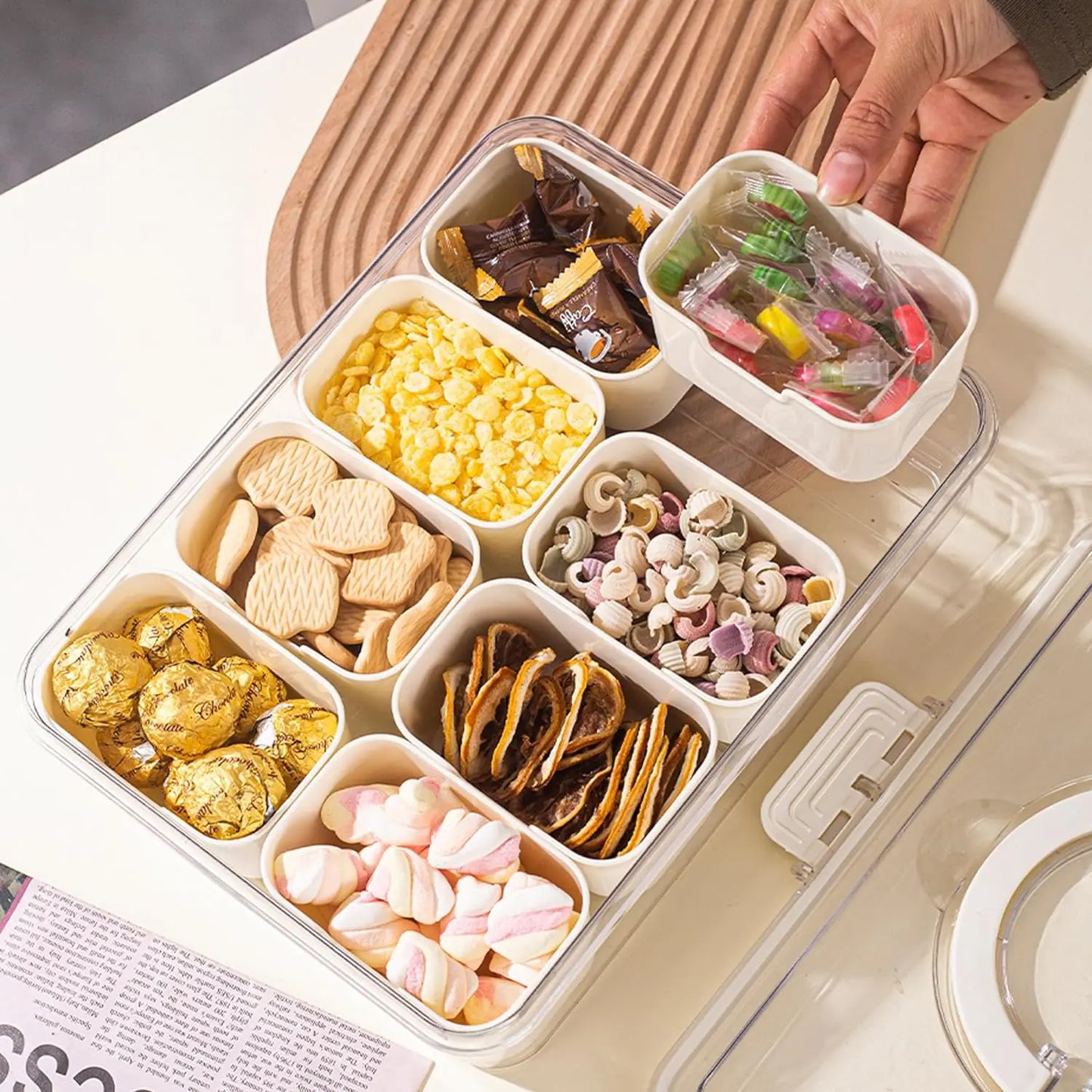 A divided serving tray storage box featuring multiple compartments, a secure lid, and a handle for easy portability; ideal for organizing and transporting snacks, fruits, nuts, or appetizers during events, picnics, or daily use