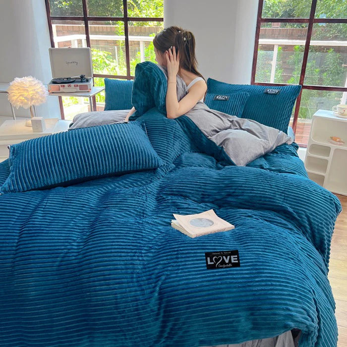 A 3-piece bedding set comprising a comforter and two pillowcases, designed to enhance your bedroom's aesthetic. Available in various patterns and materials, these sets cater to diverse preferences and are available in multiple sizes to fit different bed dimensions