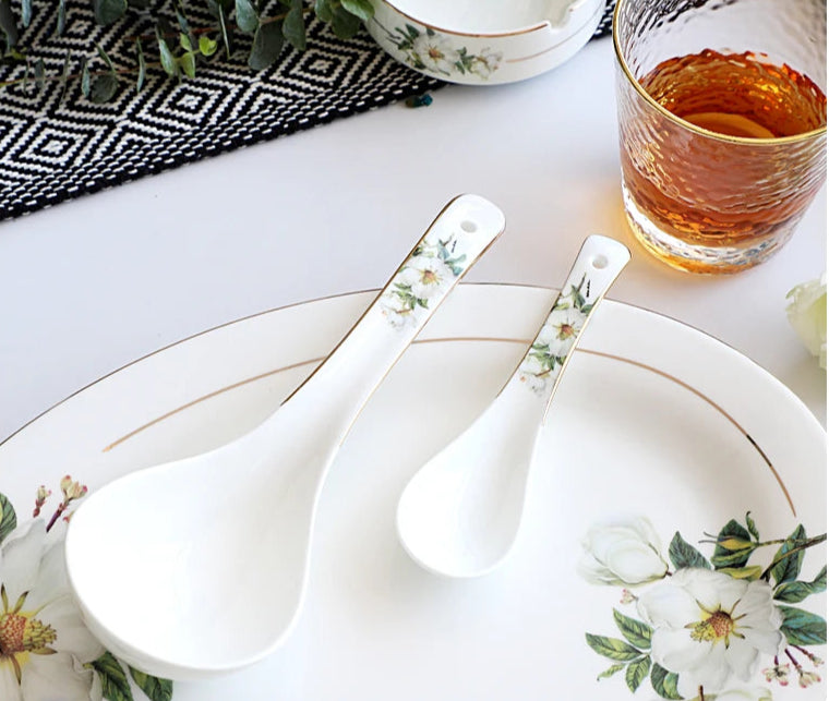 A set of bone china dinnerware comprising dinner plates, salad plates, bowls, and cups, all crafted from high-quality porcelain infused with bone ash. Renowned for its exceptional whiteness, translucency, and strength, bone china offers a luxurious feel and elegant appearance. This timeless collection is perfect for enhancing both everyday meals and special occasions