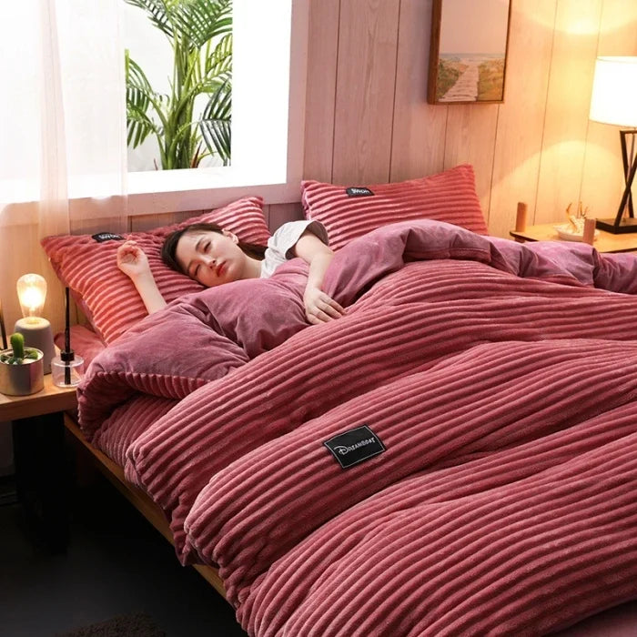 A 3-piece bedding set comprising a comforter and two pillowcases, designed to enhance your bedroom's aesthetic. Available in various patterns and materials, these sets cater to diverse preferences and are available in multiple sizes to fit different bed dimensions