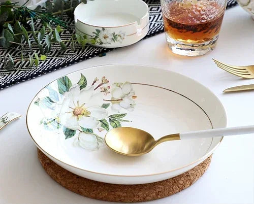 A set of bone dinnerware comprising dinner plates, salad plates, bowls, and cups, all crafted from high-quality porcelain infused with bone ash. Renowned for its exceptional whiteness, translucency, and strength, bone china offers a luxurious feel and elegant appearance. This timeless collection is perfect for enhancing both everyday meals and special occasions