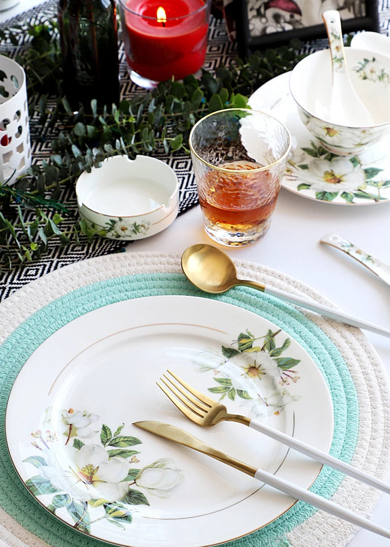 A set of bone china dinnerware comprising dinner plates, salad plates, bowls, and cups, all crafted from high-quality porcelain infused with bone ash. Renowned for its exceptional whiteness, translucency, and strength, bone china offers a luxurious feel and elegant appearance. This timeless collection is perfect for enhancing both everyday meals and special occasions