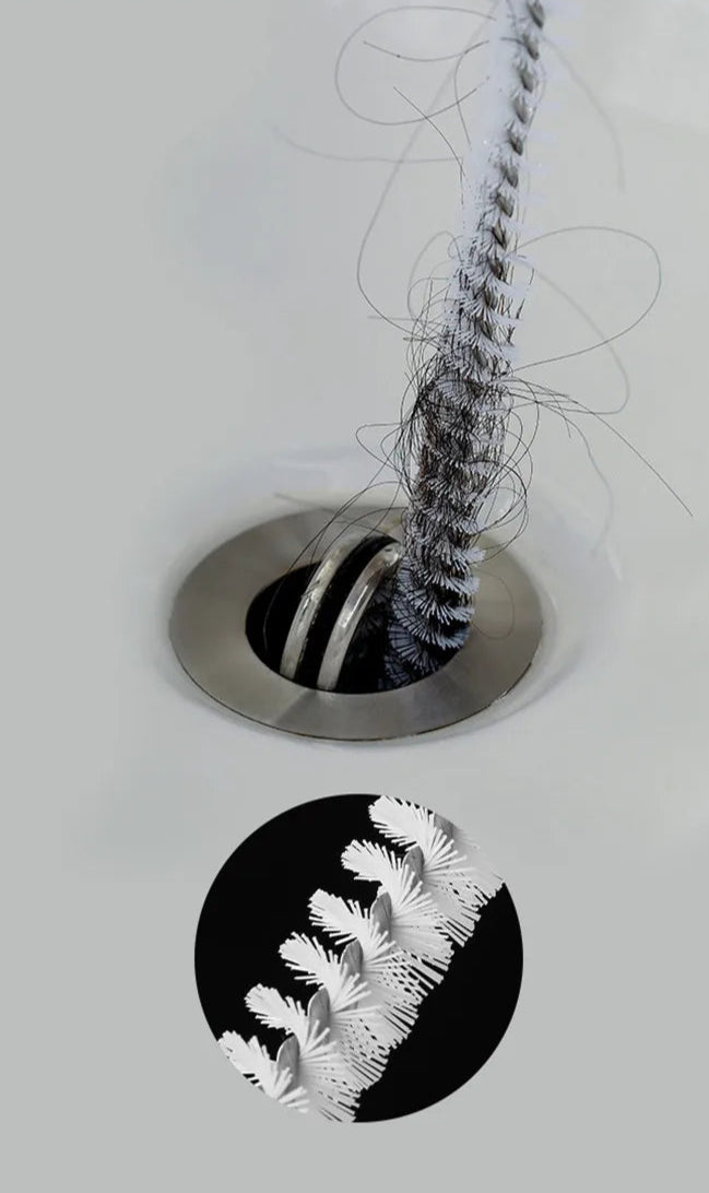 A flexible pipe dredging brush designed to clean the interior of pipes and drains. It features durable bristles attached to a long, bendable handle, allowing it to navigate through curves and remove debris, ensuring optimal water flow