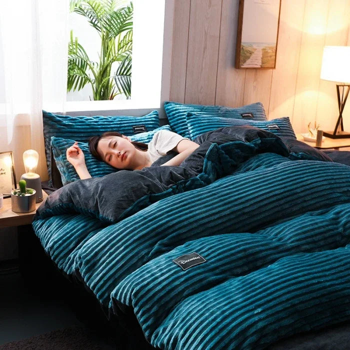 A 3-piece bedding set comprising a comforter and two pillowcases, designed to enhance your bedroom's aesthetic. Available in various patterns and materials, these sets cater to diverse preferences and are available in multiple sizes to fit different bed dimensions