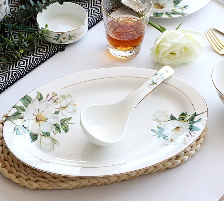 A set of bone china dinnerware comprising dinner plates, salad plates, bowls, and cups, all crafted from high-quality porcelain infused with bone ash. Renowned for its exceptional whiteness, translucency, and strength, bone china offers a luxurious feel and elegant appearance. This timeless collection is perfect for enhancing both everyday meals and special occasions
