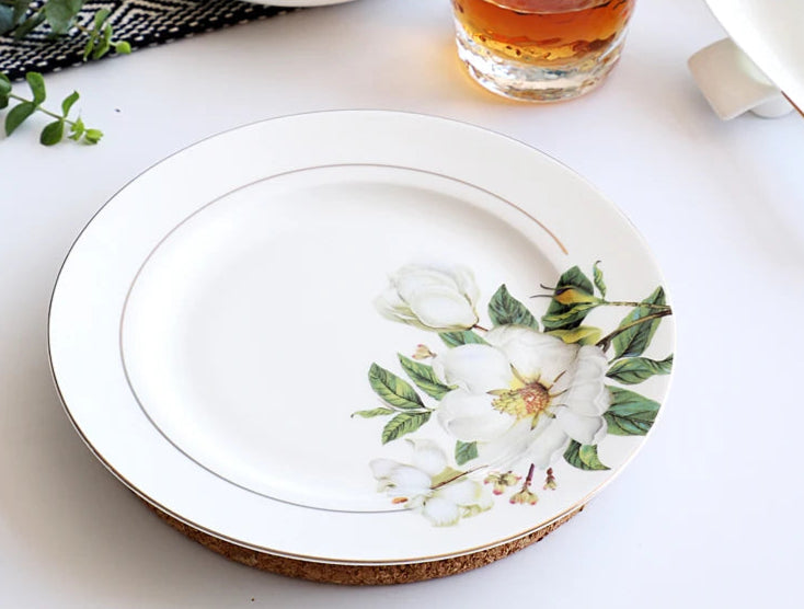 A set of bone dinnerware comprising dinner plates, salad plates, bowls, and cups, all crafted from high-quality porcelain infused with bone ash. Renowned for its exceptional whiteness, translucency, and strength, bone china offers a luxurious feel and elegant appearance. This timeless collection is perfect for enhancing both everyday meals and special occasions