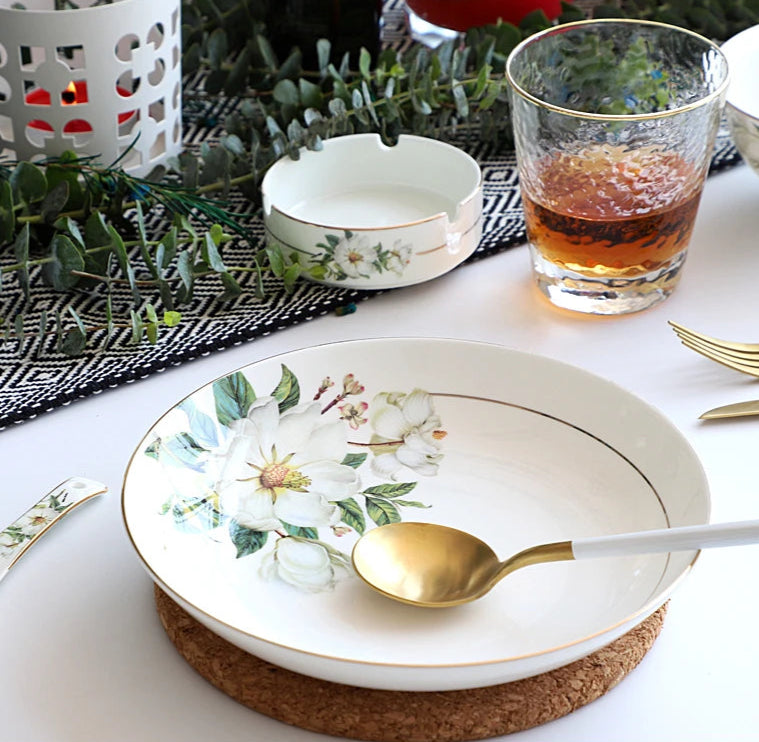 A set of bone china dinnerware comprising dinner plates, salad plates, bowls, and cups, all crafted from high-quality porcelain infused with bone ash. Renowned for its exceptional whiteness, translucency, and strength, bone china offers a luxurious feel and elegant appearance. This timeless collection is perfect for enhancing both everyday meals and special occasions
