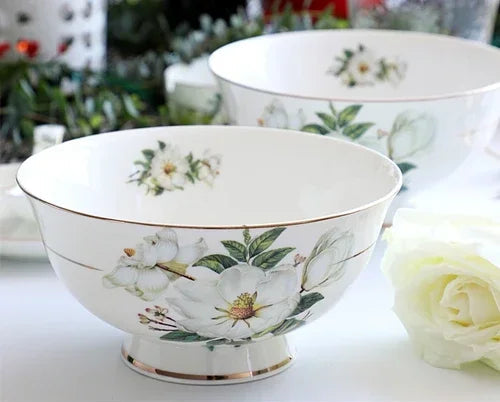A set of bone dinnerware comprising dinner plates, salad plates, bowls, and cups, all crafted from high-quality porcelain infused with bone ash. Renowned for its exceptional whiteness, translucency, and strength, bone china offers a luxurious feel and elegant appearance. This timeless collection is perfect for enhancing both everyday meals and special occasions