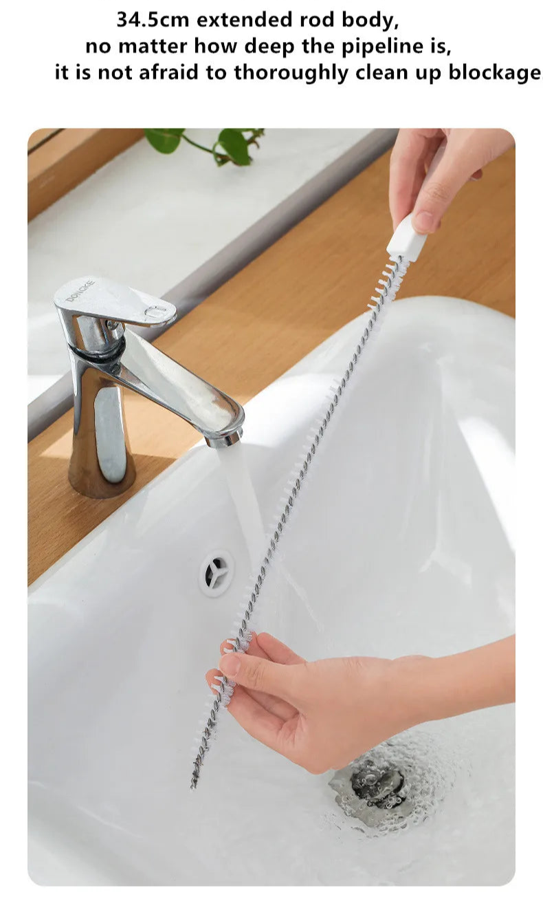 A flexible pipe dredging brush designed to clean the interior of pipes and drains. It features durable bristles attached to a long, bendable handle, allowing it to navigate through curves and remove debris, ensuring optimal water flow
