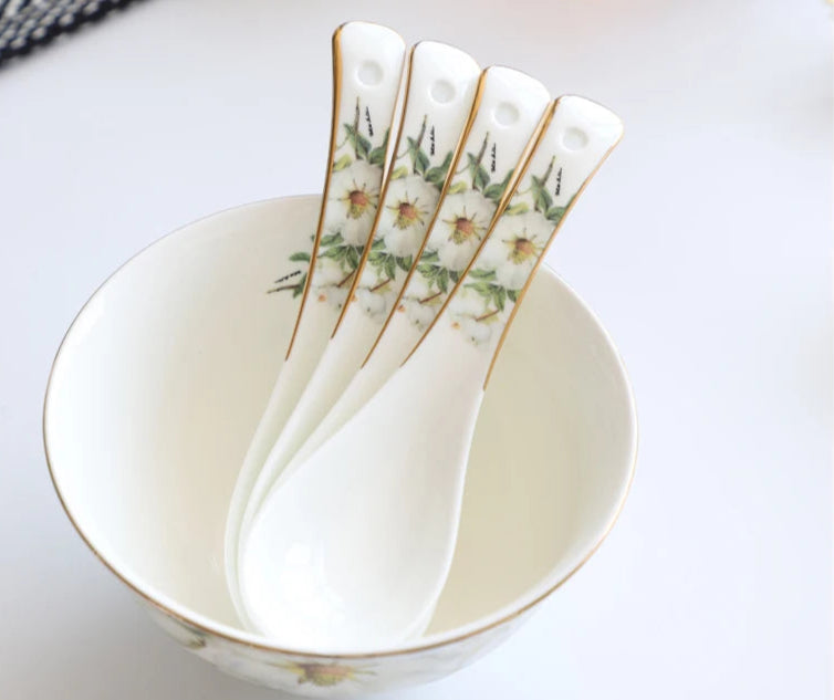 A set of bone china dinnerware comprising dinner plates, salad plates, bowls, and cups, all crafted from high-quality porcelain infused with bone ash. Renowned for its exceptional whiteness, translucency, and strength, bone china offers a luxurious feel and elegant appearance. This timeless collection is perfect for enhancing both everyday meals and special occasions