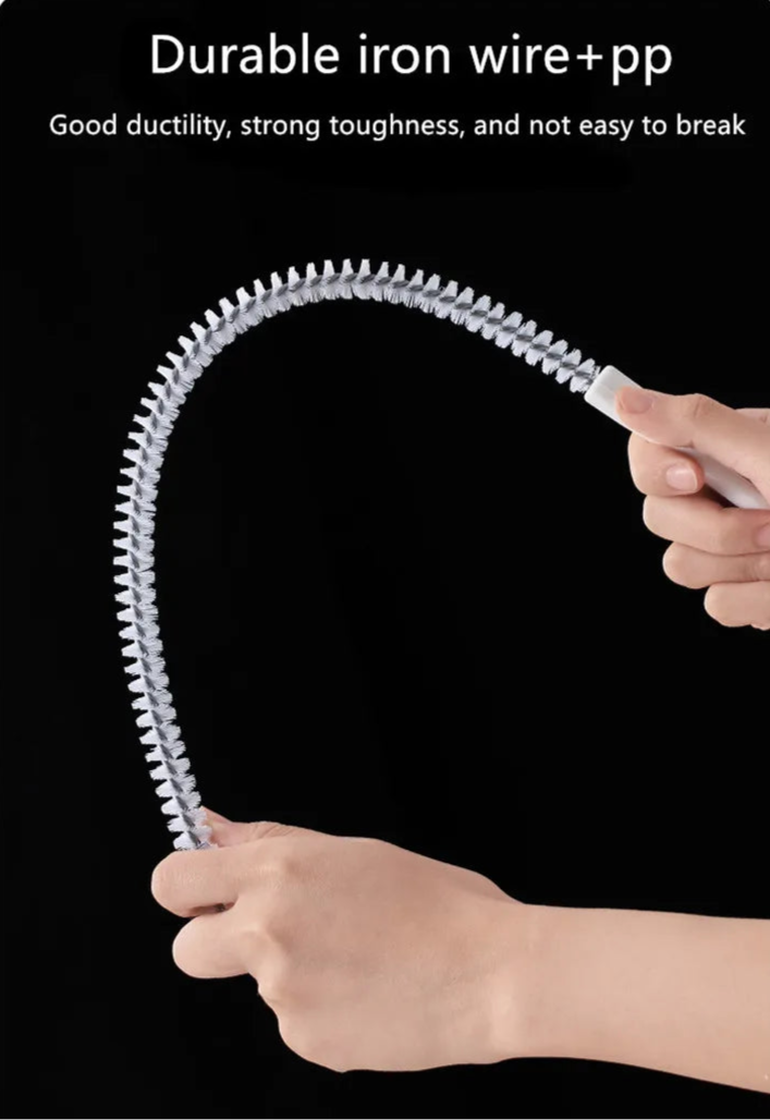 A flexible pipe dredging brush designed to clean the interior of pipes and drains. It features durable bristles attached to a long, bendable handle, allowing it to navigate through curves and remove debris, ensuring optimal water flow