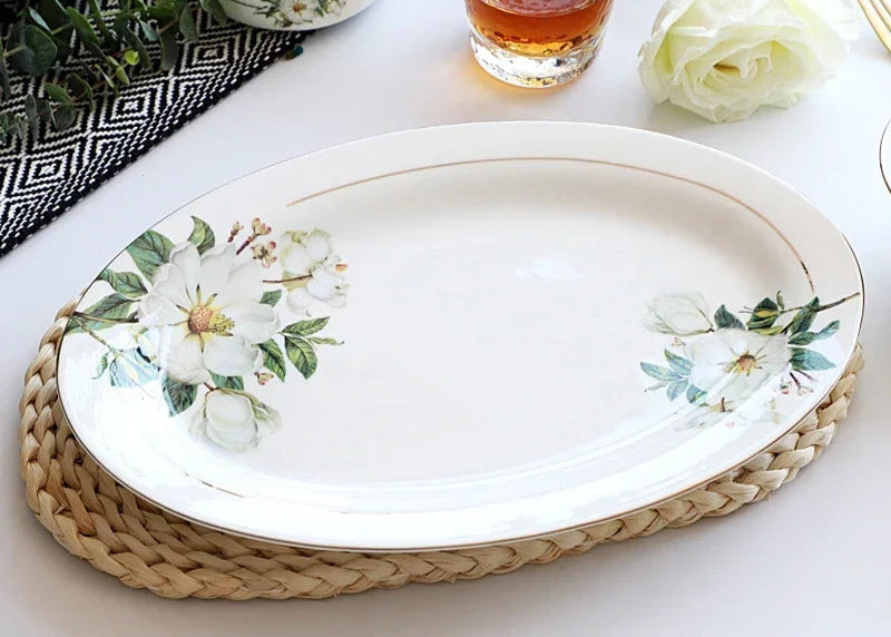 A set of bone china dinnerware comprising dinner plates, salad plates, bowls, and cups, all crafted from high-quality porcelain infused with bone ash. Renowned for its exceptional whiteness, translucency, and strength, bone china offers a luxurious feel and elegant appearance. This timeless collection is perfect for enhancing both everyday meals and special occasions