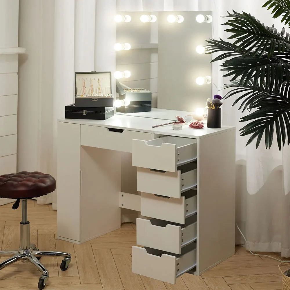 A stylish Hollywood makeup dressing table with bright LED lights around the mirror, offering a well-lit space for makeup application. The table features a sleek design with ample storage space for cosmetics and beauty tools.