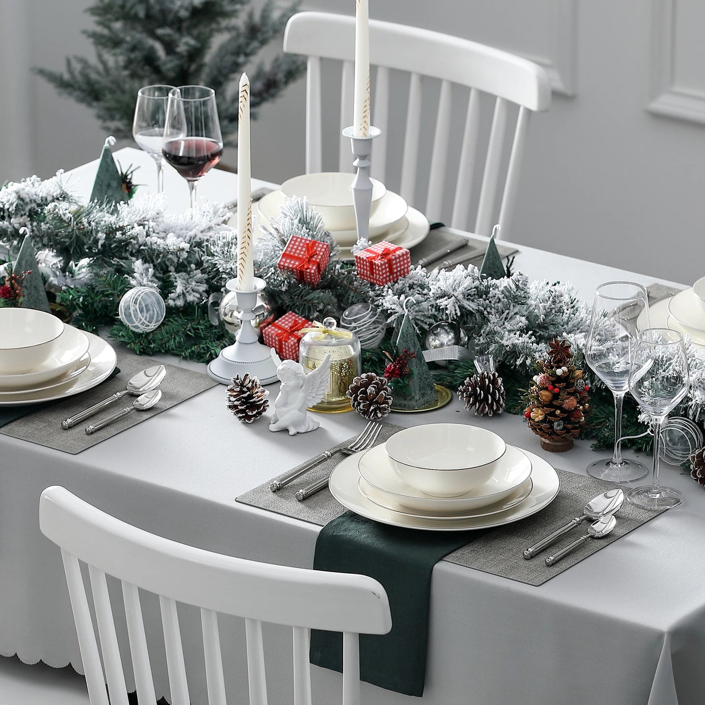 A complete dinnerware set including dinner plates, salad plates, bowls, and mugs, all featuring a sleek, modern design in a neutral color palette