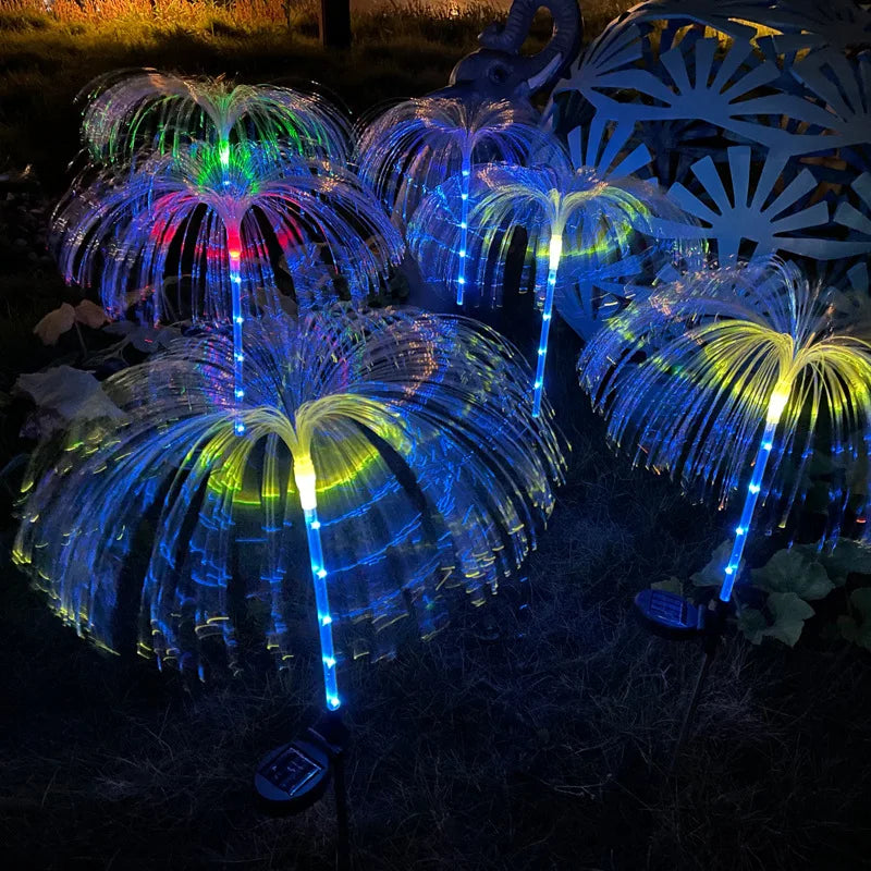 A solar-powered fiber optic lamp featuring multi-color illumination. The lamp harnesses sunlight during the day to power vibrant, color-changing fiber optic strands at night, creating a mesmerizing display suitable for gardens, patios, or outdoor pathways.