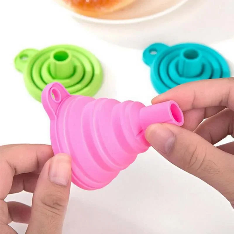 A foldable funnel, also known as a collapsible funnel, is a kitchen tool designed to assist in transferring liquids or powders into containers with small openings. Made from flexible materials like silicone, these funnels can be expanded for use and collapsed for convenient storage, making them space-efficient and practical for various kitchen tasks
