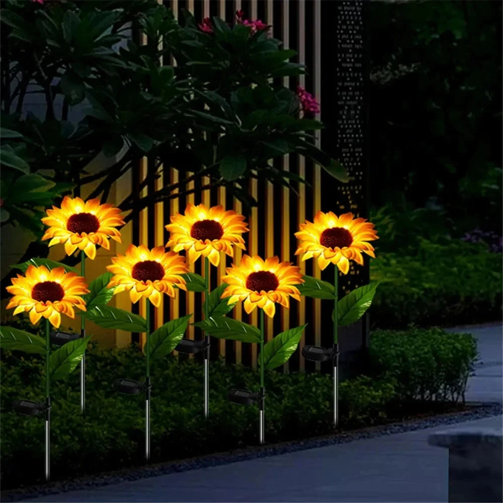 Solar-powered LED lights designed to resemble sunflowers, featuring realistic petals and leaves. These decorative lights harness sunlight during the day to illuminate gardens, pathways, or patios at night, adding a charming and eco-friendly touch to outdoor spaces