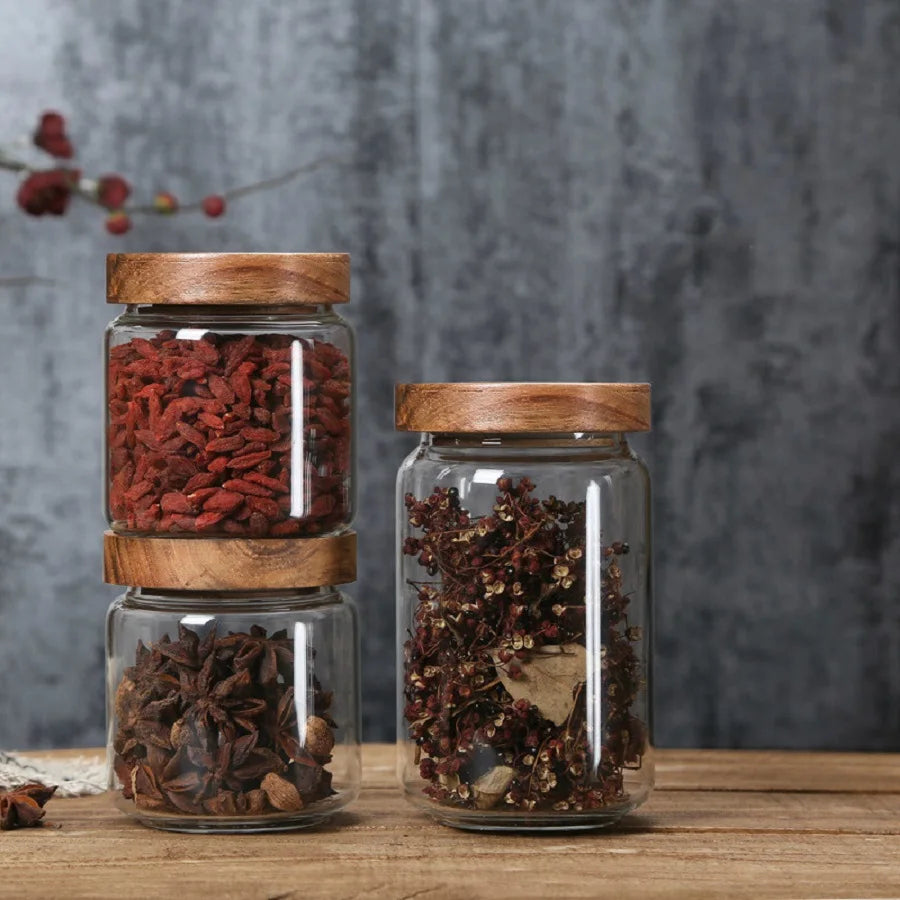 A collection of clear glass storage jars with airtight lids, ideal for organizing and preserving various kitchen staples such as pasta, grains, spices, and snacks. Their transparent design allows for easy identification of contents, while the airtight seals maintain freshness and prevent moisture intrusion. These jars not only provide practical storage solutions but also add a touch of elegance to kitchen countertops or pantry shelves