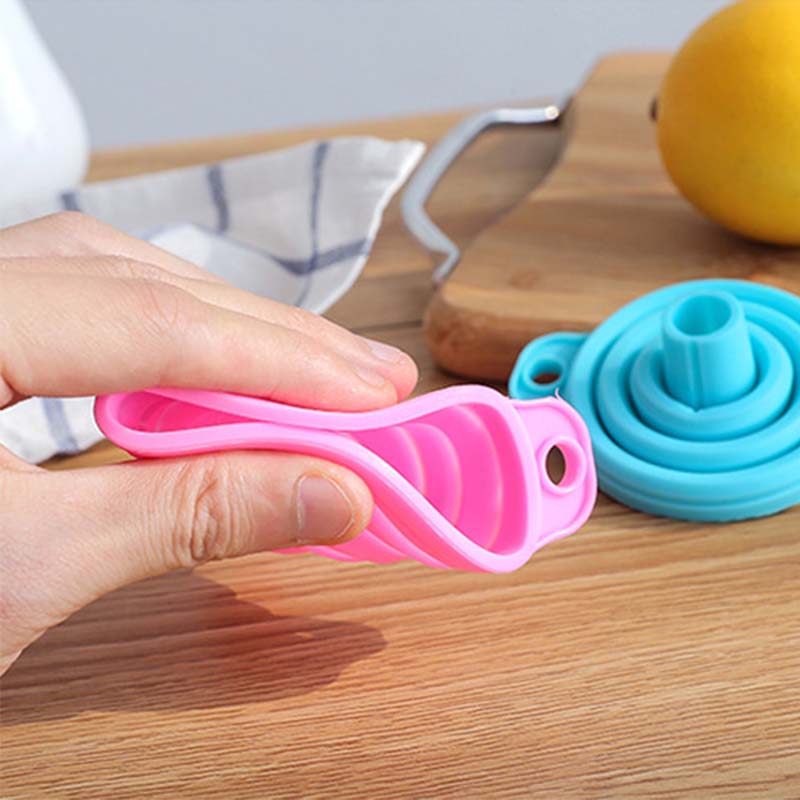 A foldable funnel, also known as a collapsible funnel, is a kitchen tool designed to assist in transferring liquids or powders into containers with small openings. Made from flexible materials like silicone, these funnels can be expanded for use and collapsed for convenient storage, making them space-efficient and practical for various kitchen tasks