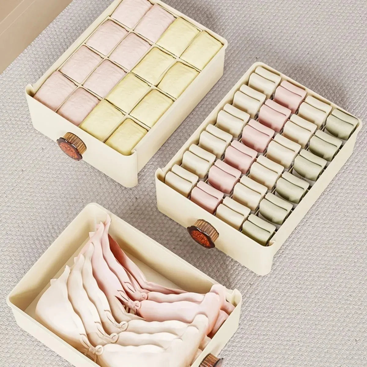 A set of foldable drawer organizers designed for underwear storage, featuring multiple compartments to neatly separate and organize socks, bras, and panties; made from breathable fabric to protect garments and maintain freshness