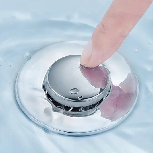 A Pop-Up Sink Drain Filter is a sink drain stopper featuring a built-in strainer that prevents debris and hair from entering the drain, thereby reducing the likelihood of clogs. It typically consists of a stopper with a spring-loaded mechanism, allowing users to open or close the drain with a simple press. The integrated strainer captures unwanted particles, ensuring efficient drainage and easier maintenance